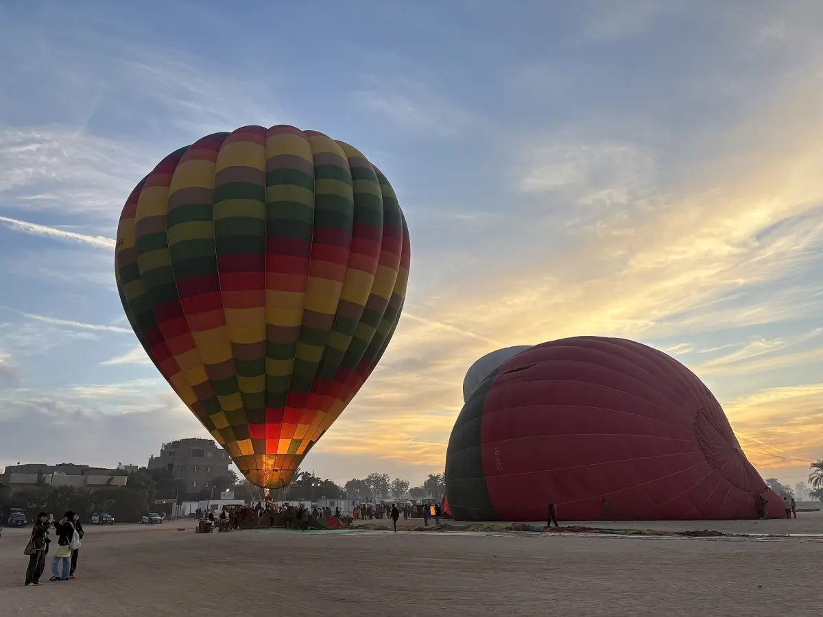 A balloon being inflated at dawn in Luxor