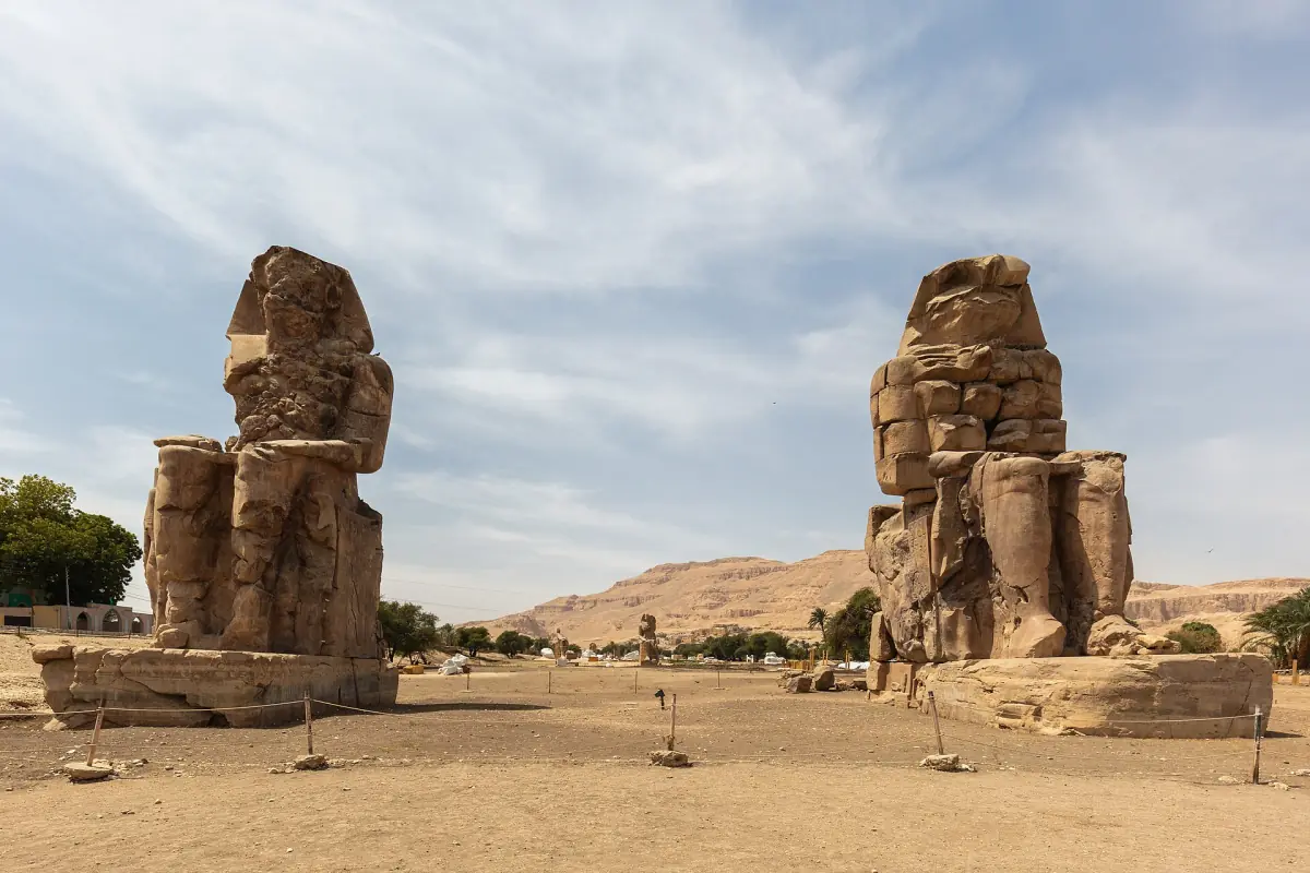 The two Colossi of Memnon under a light sky